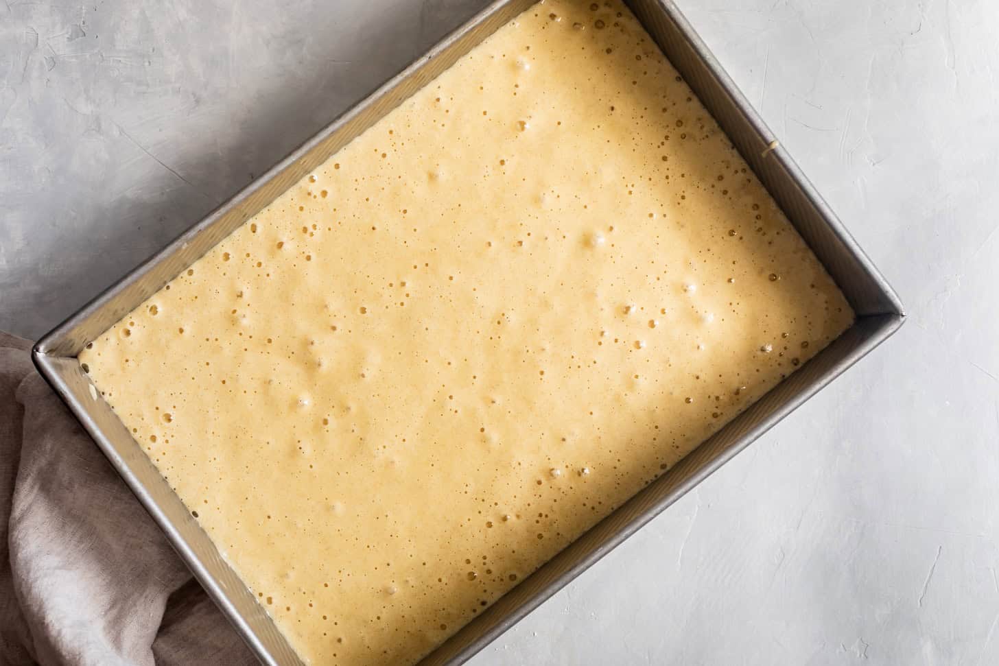 Unbaked batter in baking pan for tres leches cake