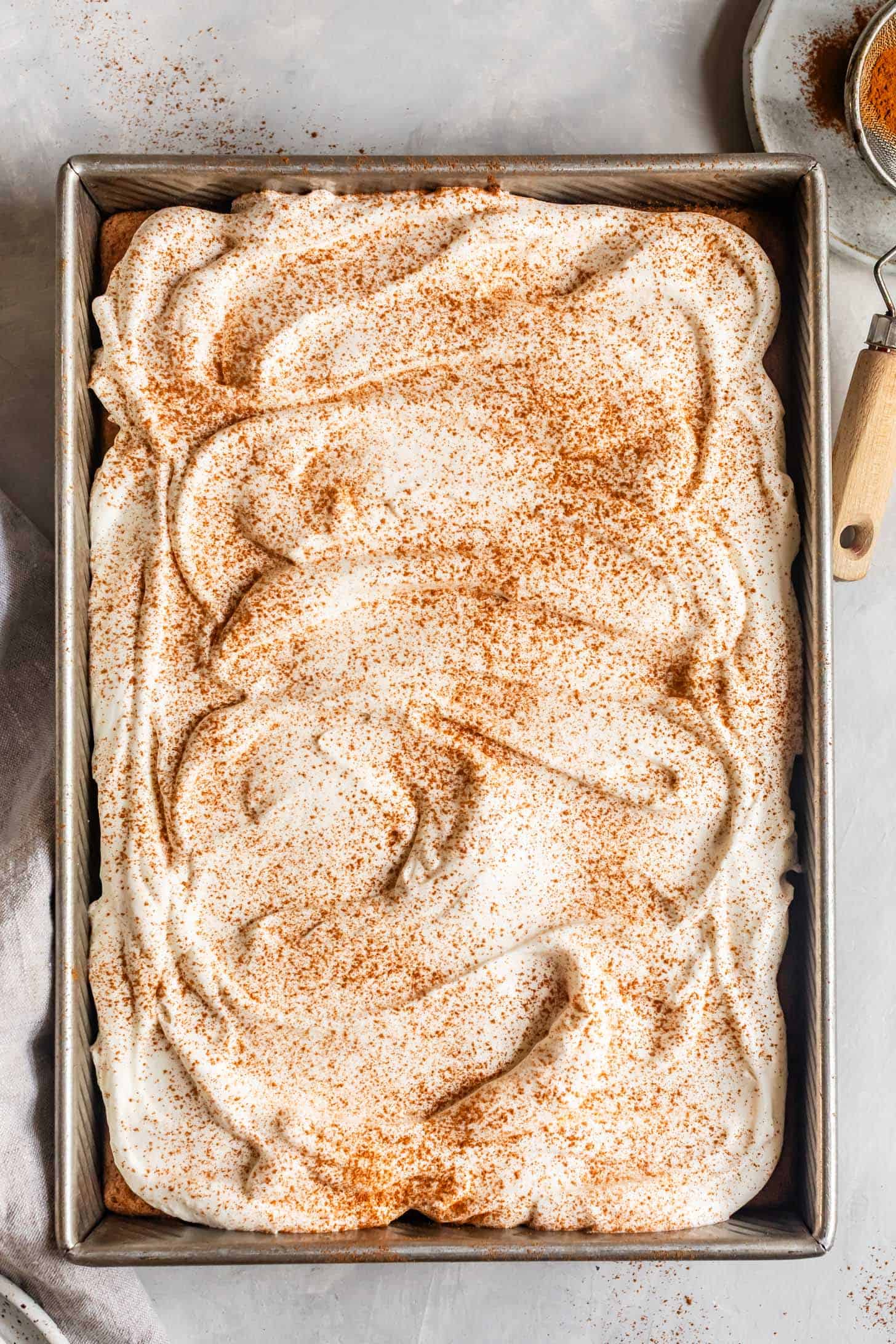 Whole Gluten-Free Tres Leches Cake with Whipped Cream and Cinnamon