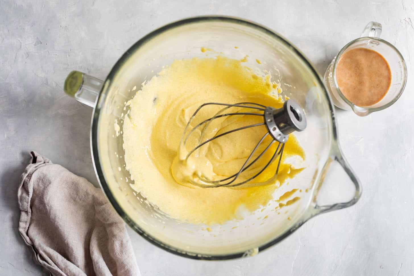 Whisking the egg yolks and sugar for tres leches cake