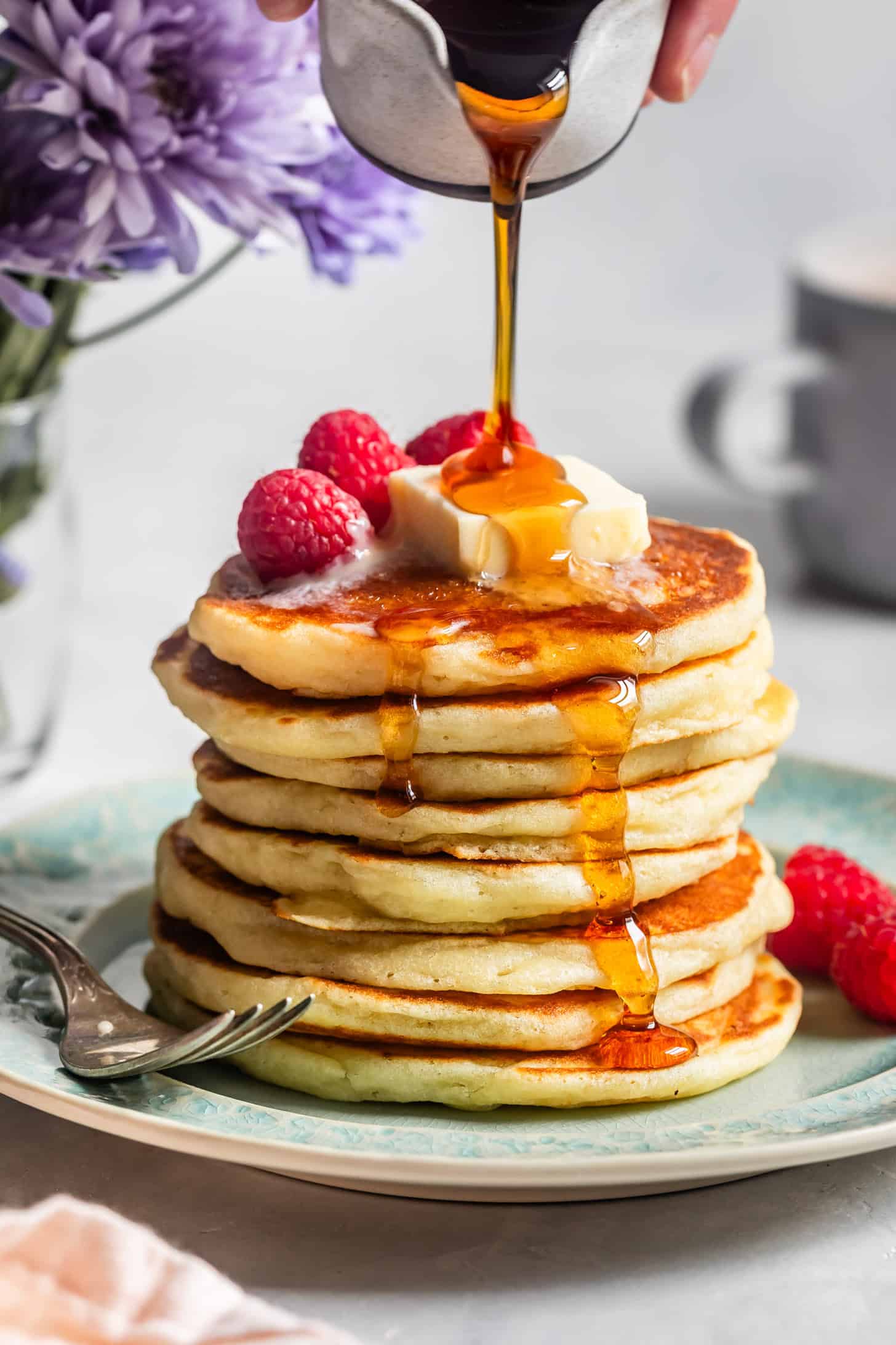 Stack of mochi pancakes with syrup drizzle