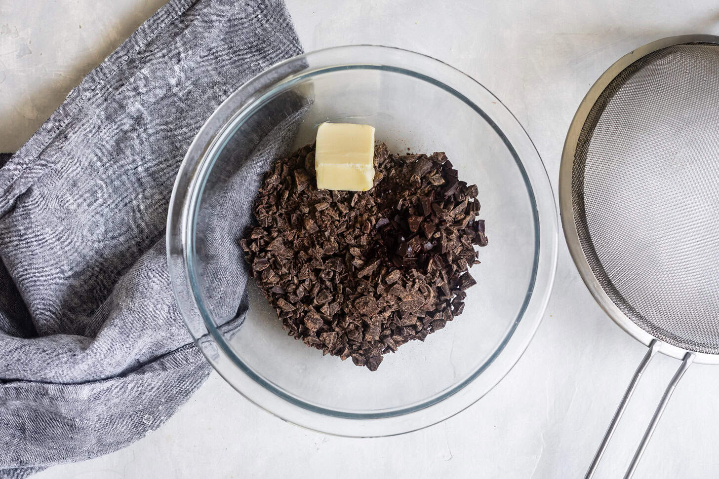 Chopped chocolate and butter for pudding.