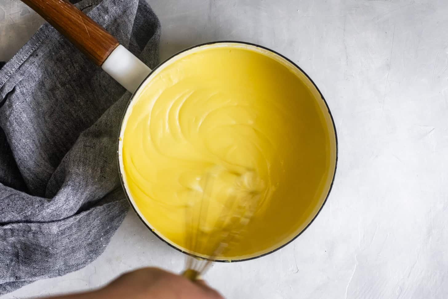 Cooked vanilla pudding in pot