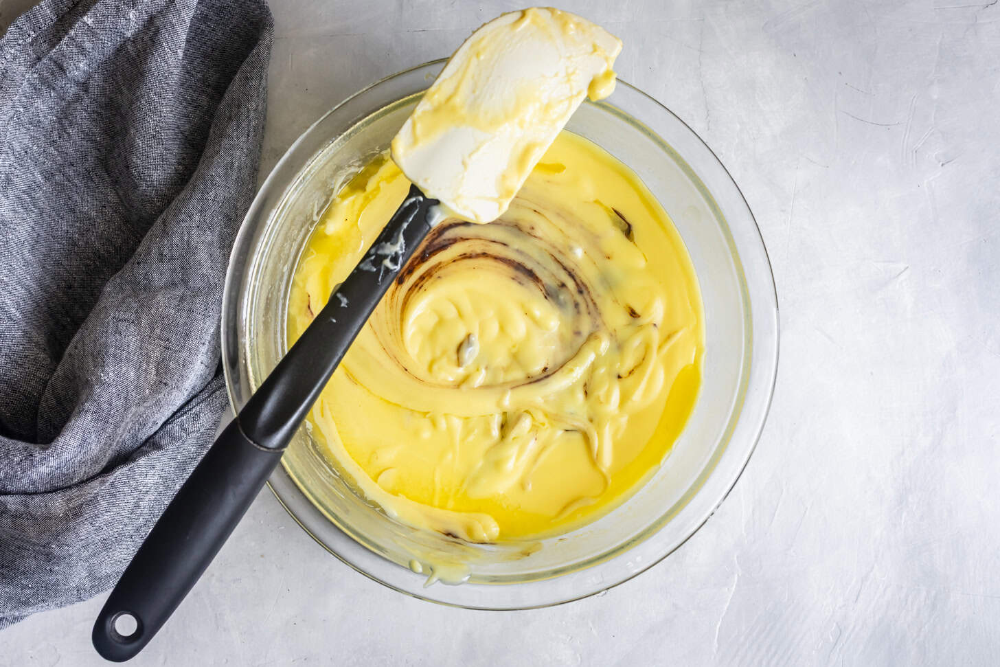 Stirring custard with chocolate for pudding