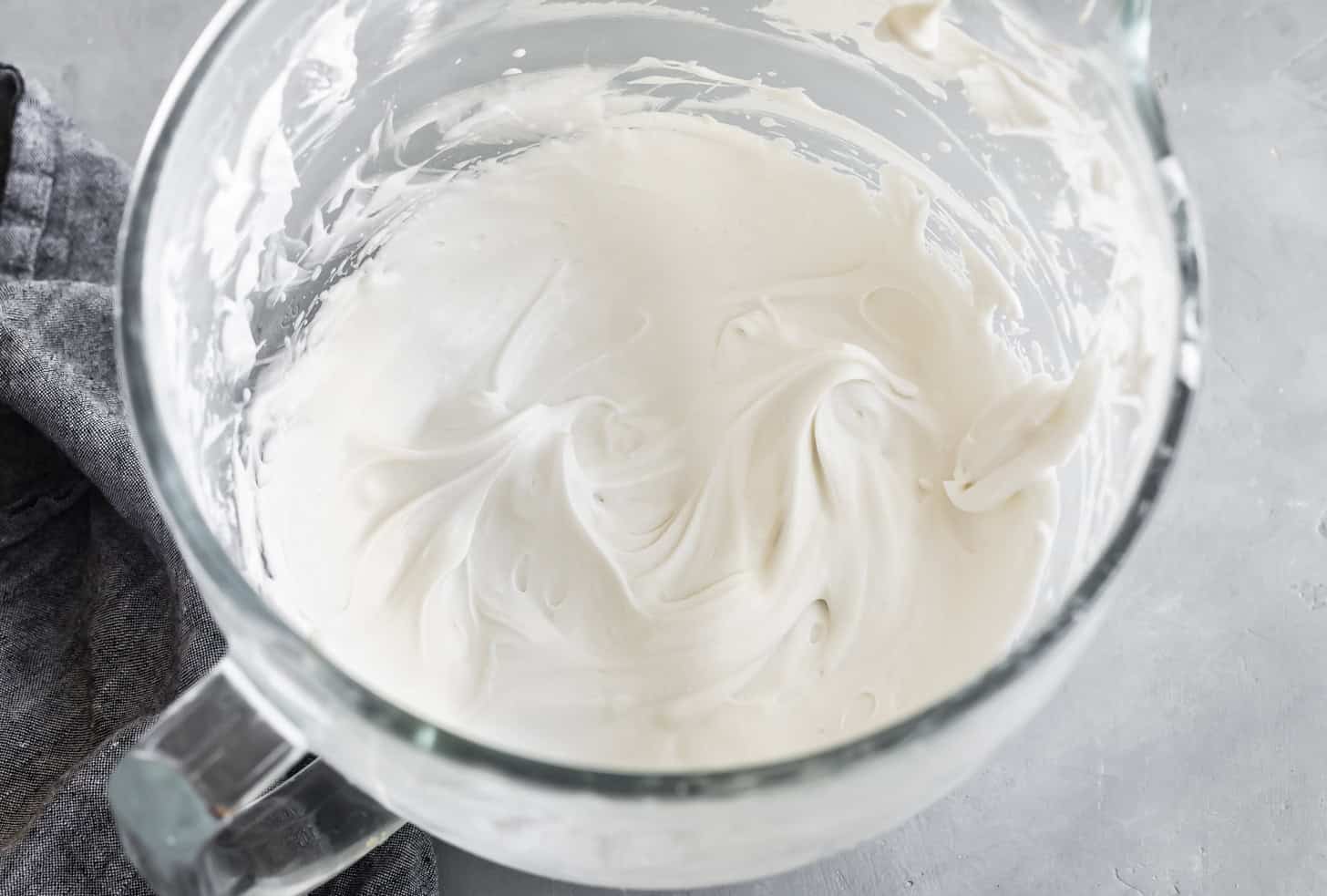 Soft Peaks of Whipped Coconut Cream in Mixing Bowl