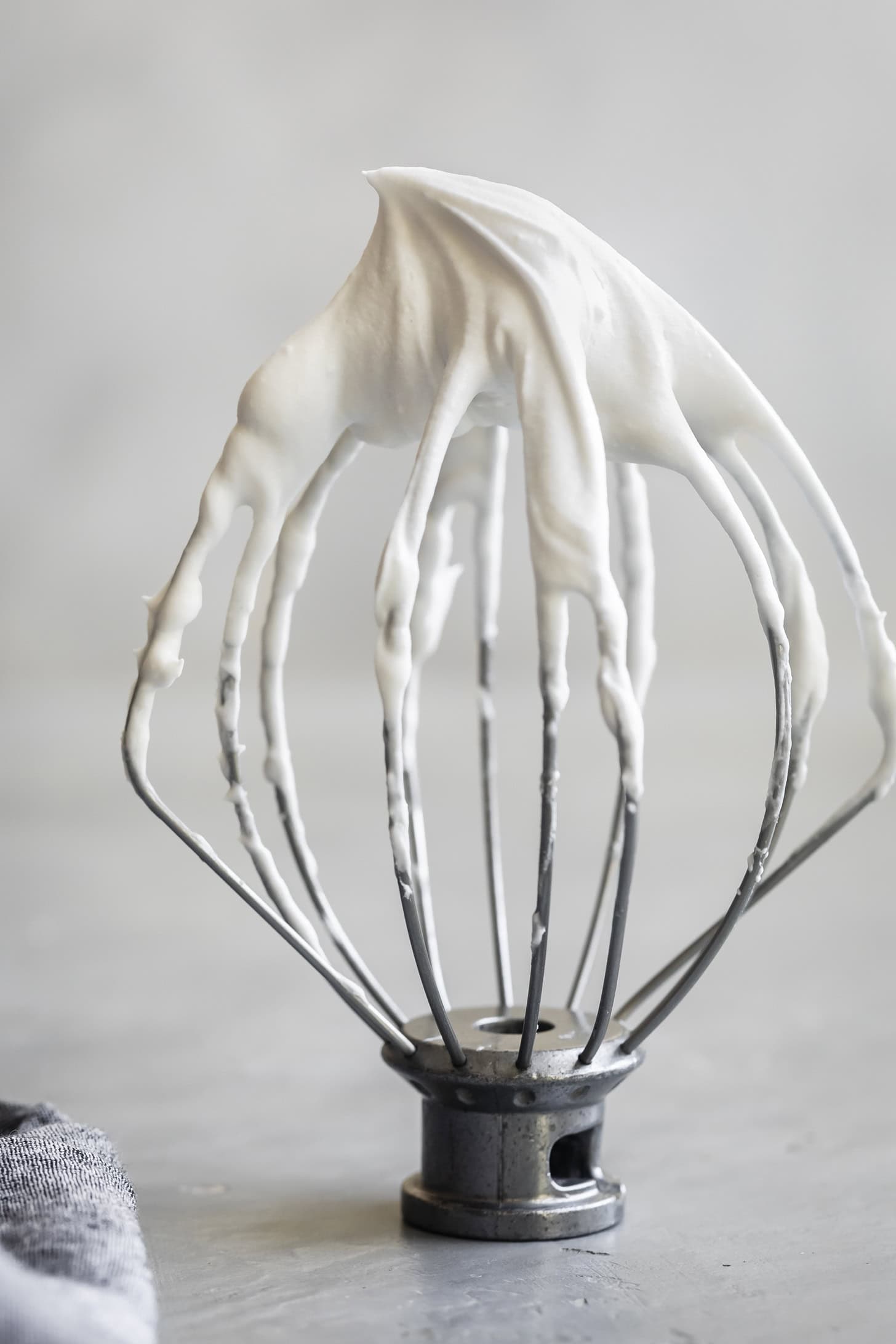 Whisk with soft peaks of whipped coconut cream