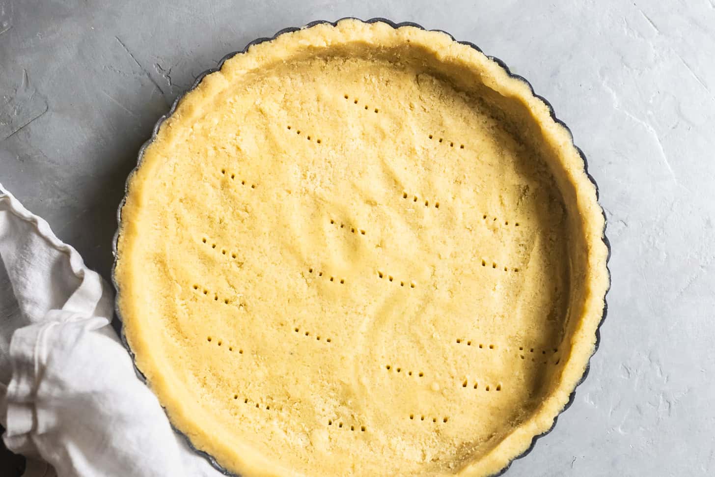Unbaked Gluten-Free Tart Crust docked with Fork