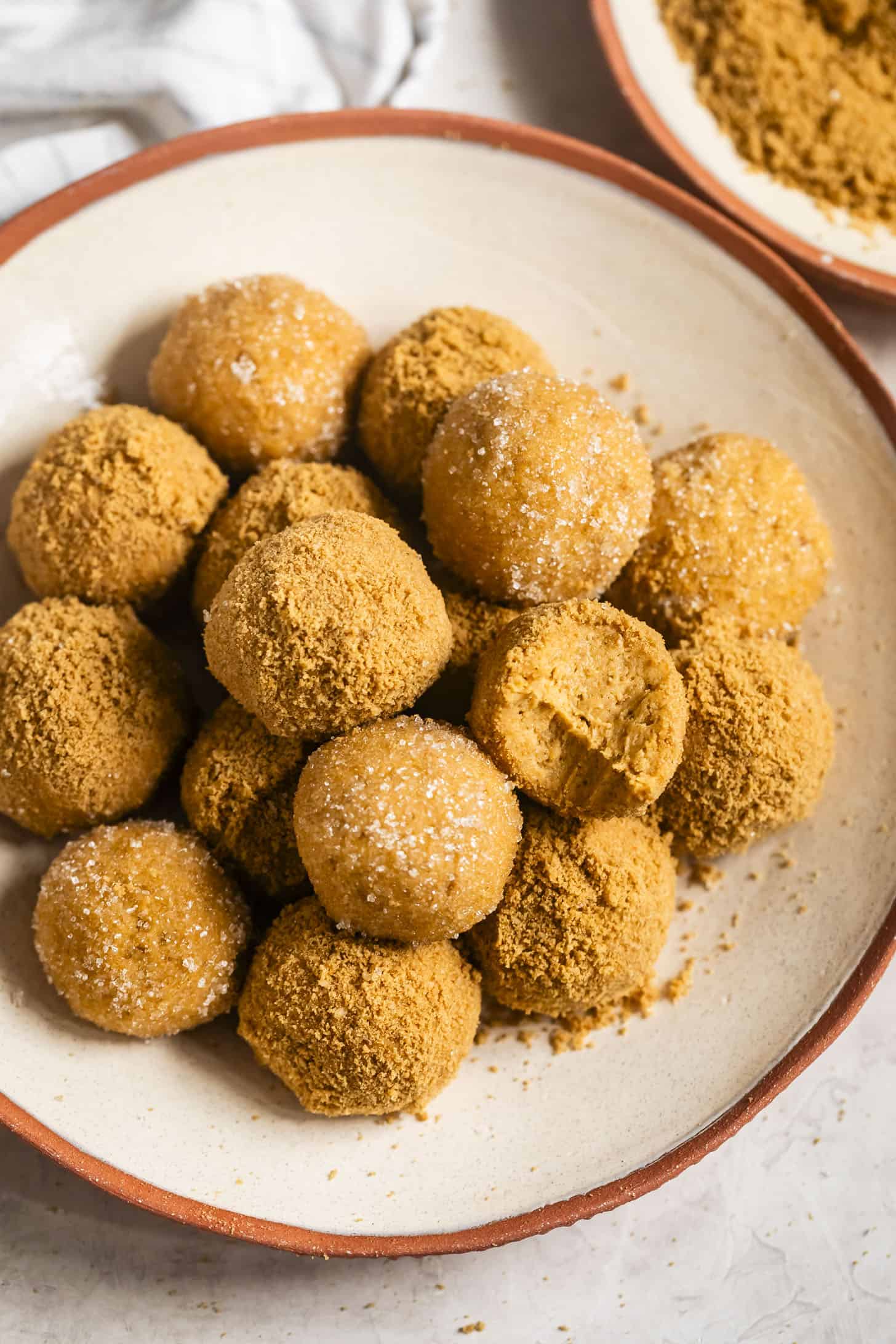 No-Bake Pumpkin Cheesecake Balls with Bite on Serving Platter