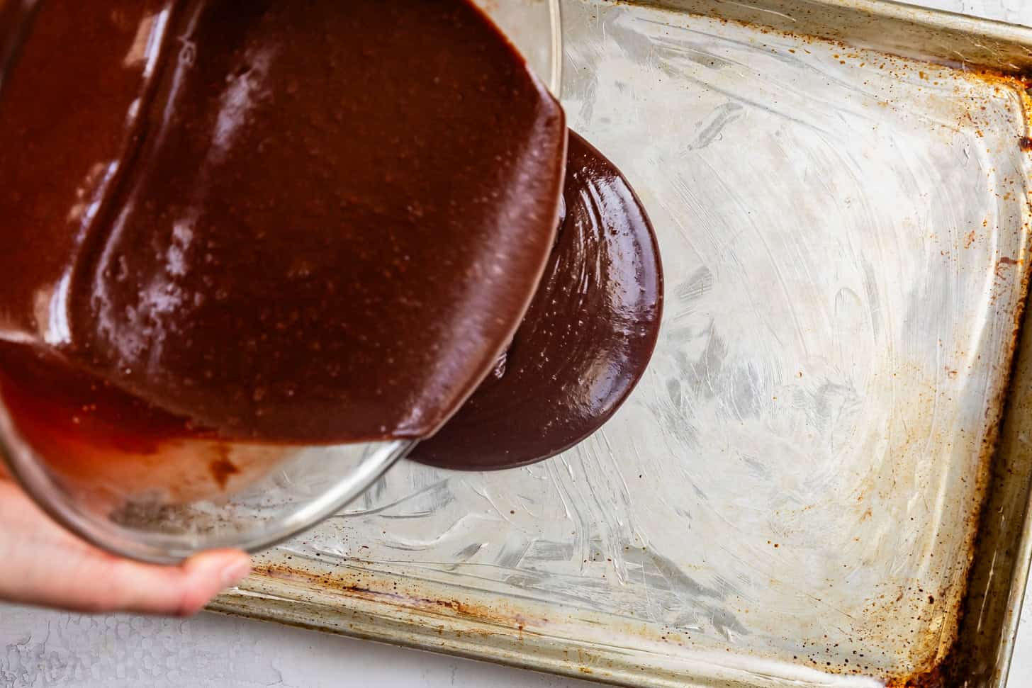 Pouring Chocolate Cake Batter into Buttered Jelly Roll Sheet Pan
