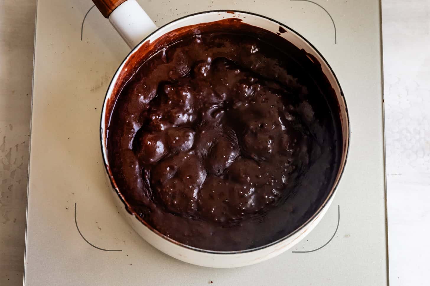 A saucepan of bubbling fudge icing