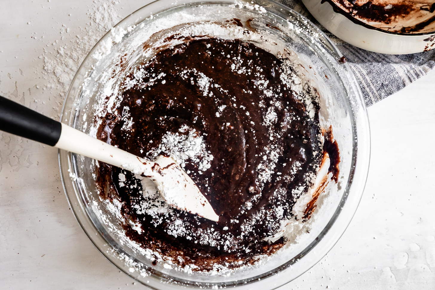 Mixing Chocolate Butter into Powdered Sugar for Fudgy Icing