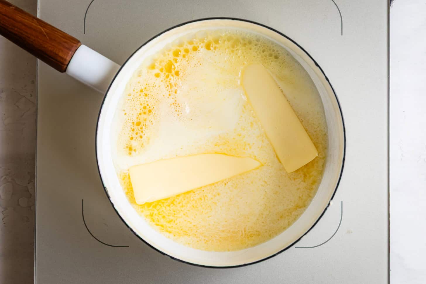 Melting Butter in White Pot