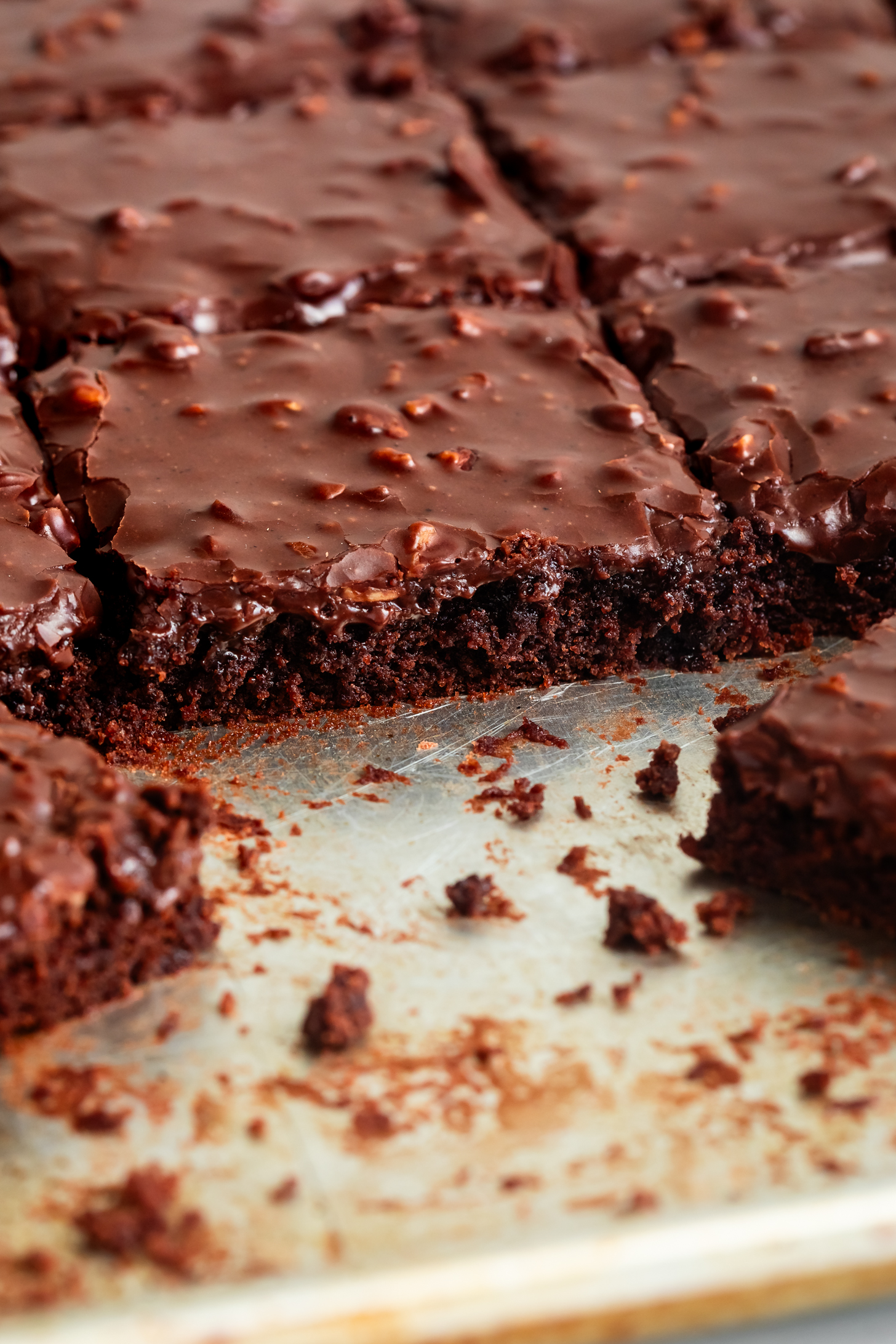 Inside edge of gluten-free Texas sheet cake on baking sheet