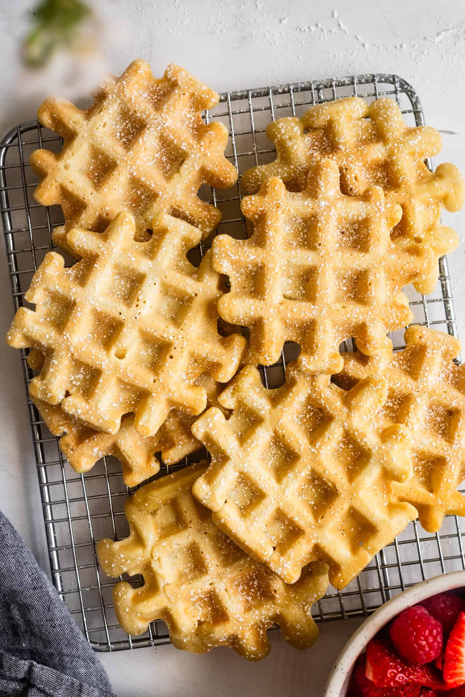 Granulated sugar chewy mochi waffles dusted with sugar on a cooling rack