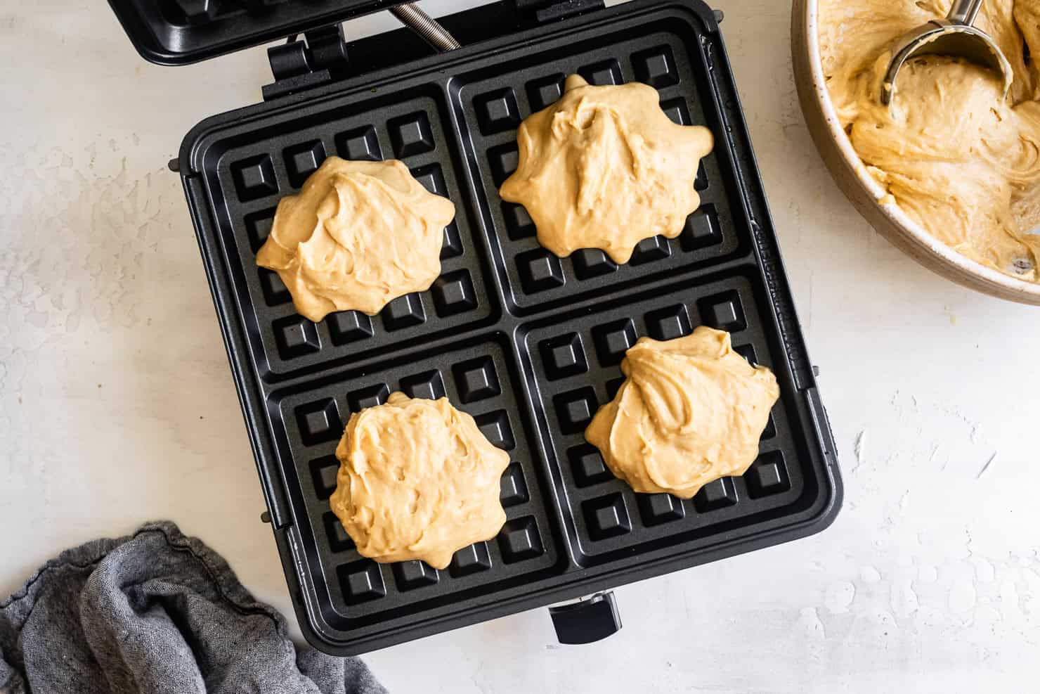 Waffle maker with four scoops of chewy mochi waffle batter